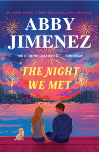 The cover for "The Night We Met" by Abby Jimenez features a couple sitting on a wooden dock, looking out over a calm, starry night sky with a dog sitting beside them.